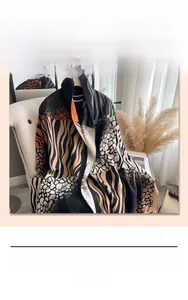 Macro shot of faux cashmere scarf with black, caramel, and white zebra pattern