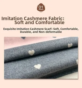 Macro detail of soft cashmere-like scarf fabric with pink heart patterns and grey texture