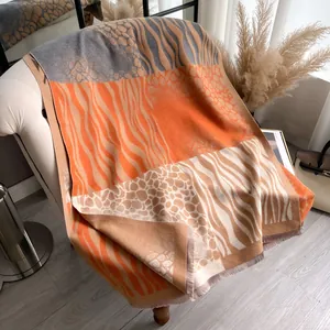 Zebra and animal print pashmina shawl with orange color block and tassel fringe edges