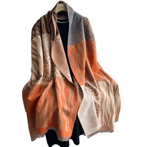 Warm zebra and leopard print patchwork scarf with fringes for autumn and winter