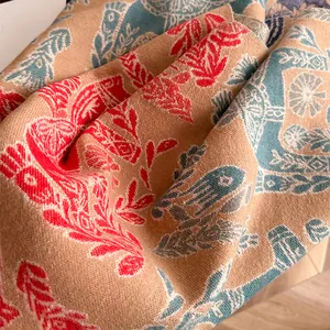 Detailed macro view of bohemian jacquard fabric with elephant and leaf patterns