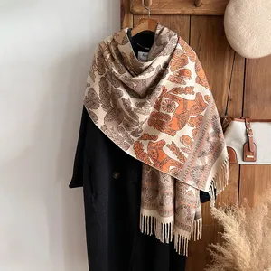 Ethnic style pashmina shawl with horse and leaf patterns on a black coat