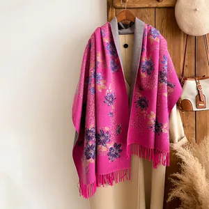 Elegant fuchsia cornflower embroidered cashmere shawl with fringe on beige wool coat