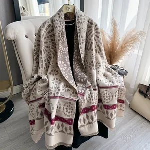 Beige cashmere shawl with dark coffee geometric snowflake patterns and tassel edges