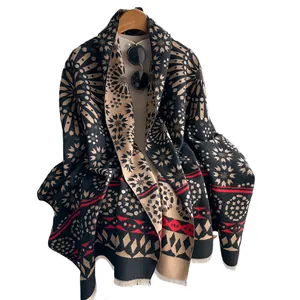 Women's cashmere wool scarf with geometric star pattern and tassels on wooden hanger