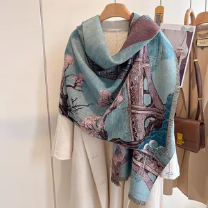 Detail of floral cashmere scarf with Eiffel Tower print and elegant tassel edges