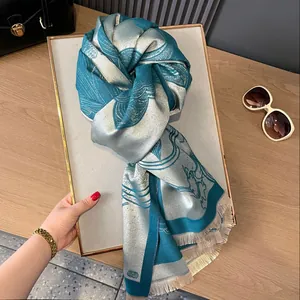 Lake blue and silver lotus jacquard scarf with elegant tassels for autumn warmth