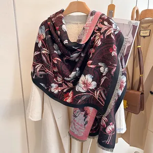 Close-up of vintage floral print scarf with soft tassels and thick cashmere-like texture