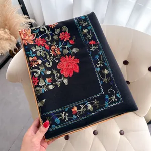 Close-up of premium black pashmina shawl featuring intricate floral ethnic embroidery