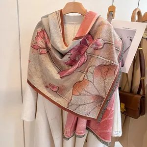 Detail of elegant pashmina scarf with lotus pattern, fringe edges and handmade label