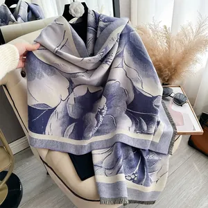 Detail view of winter floral scarf with lilac and beige knit textures and tassel edges