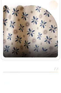 Detailed texture of the warm cashmere scarf featuring blue sunflower patterns on khaki fabric
