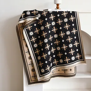 Women's warm winter shawl with black and beige floral knit patterns and fringe tassels