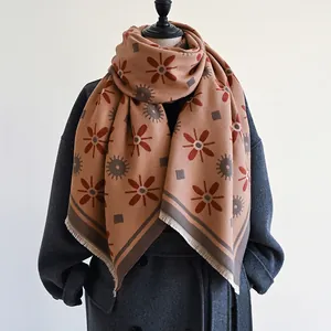 Women's warm cashmere-like shawl with brown floral and geometric patterns and tassels