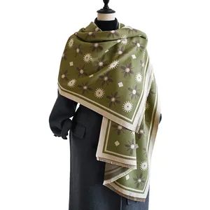 Olive green cashmere-like scarf with daisy patterns on mannequin in white background