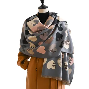 Gray cashmere-like scarf with large heart patterns and fringe trim for autumn and winter