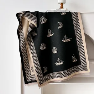 Detail of sailboat pattern and houndstooth border on soft winter cashmere shawl
