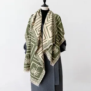 Minimalist green and beige cashmere-feel scarf with geometric floral and palm tree patterns