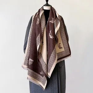 Detail of vintage double-sided scarf showing sailboat print and houndstooth fringe edges