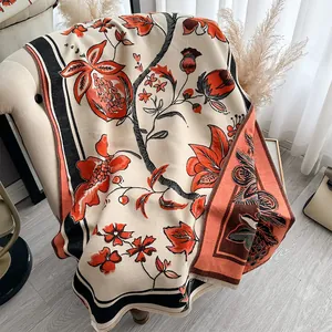 Detail of pomegranate floral pattern on soft fringed beige pashmina scarf shawl
