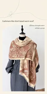 Close-up of floral cashmere feel scarf featuring short fringe tassels and warm earthy tones