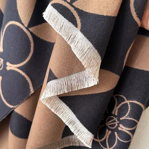 Minimalist geometric cashmere-style scarf with abstract floral patterns and beige fringes