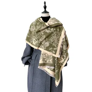 Olive green cashmere-like shawl with beige floral patterns and fringe edges