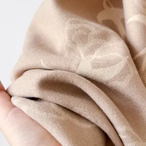 Elegant cashmere-like scarf with swallow and auspicious cloud patterns in oatmeal beige