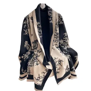 Elegant cashmere-like scarf featuring chic bamboo print and delicate fringed edges