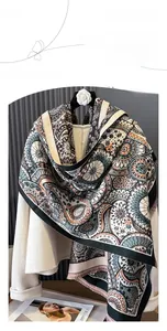 Close-up of bohemian pattern printed on a soft cashmere-feel shawl with tassel fringe