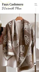 Détail du motif de feuilles en maille jacquard sur châle d'hiver doux au toucher