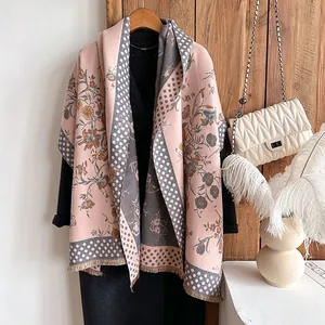 Detail of floral and dot pattern double-sided pashmina shawl with tassel fringe