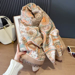 Vintage paisley pattern shawl wrap with elegant fringe edges and warm cashmere feel