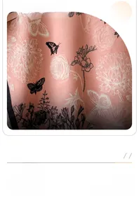 Detail shot of the floral line art pattern and warm cashmere-feel texture of the scarf