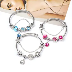 Three-piece set of silver wire rope charm bracelets with crystal beads and safety chains