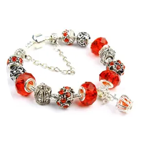 Bohemian silver snake chain bracelet with red faceted glass beads and crown charms