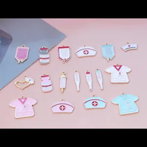 Pink enamel nurse theme charms set featuring medical uniform syringe and heart pendants