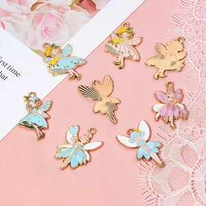 Detail of colorful flower fairy charms with gold edging and textured backs for DIY jewelry