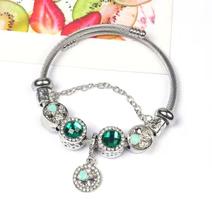 Silver stainless steel clover charm bracelet with green crystal beads and heart patterns