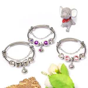 DIY charm bracelets set with four-leaf clover beads and heart pendants in three colors