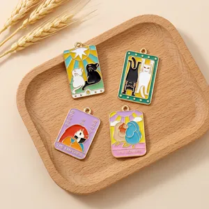 Detailed view of tarot animal enamel charms featuring The Empress and The Lovers designs