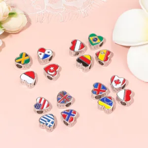 Macro shot of heart-shaped national flag beads with silver edges for DIY bracelet