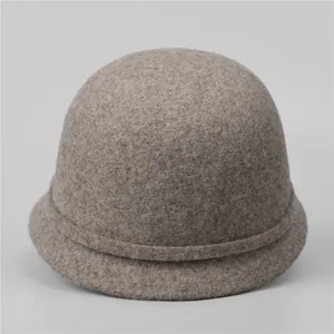 Detailed texture of taupe wool felt newsboy cap with vintage pleat detail and rounded top