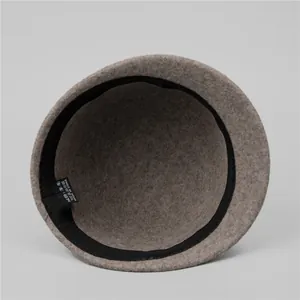 Detailed interior of vintage wool felt equestrian hat with inner sweatband and fabric tag