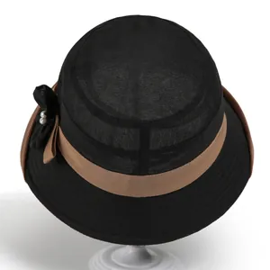 Elegant black woven sun hat for women with brown ribbon, bow and pearl details
