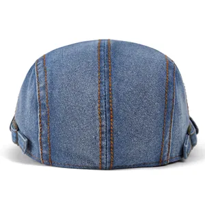 Blue denim washed beret cap with contrast orange stitching and adjustable side buckle