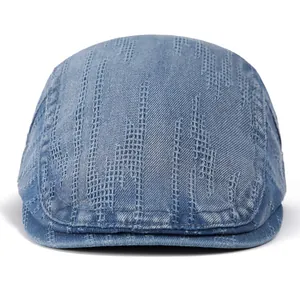 Macro detail of vintage blue denim flat cap showing pixelated vertical stripe texture