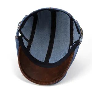 Vintage blue denim ivy cap with brown PU leather brim and adjustable metal buckle closure