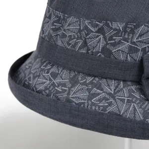 Close-up of dark grey cotton linen sun hat with geometric pattern and small rolled brim
