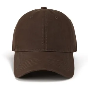 Detailed close-up of dark brown cotton baseball cap showing top button and air vents